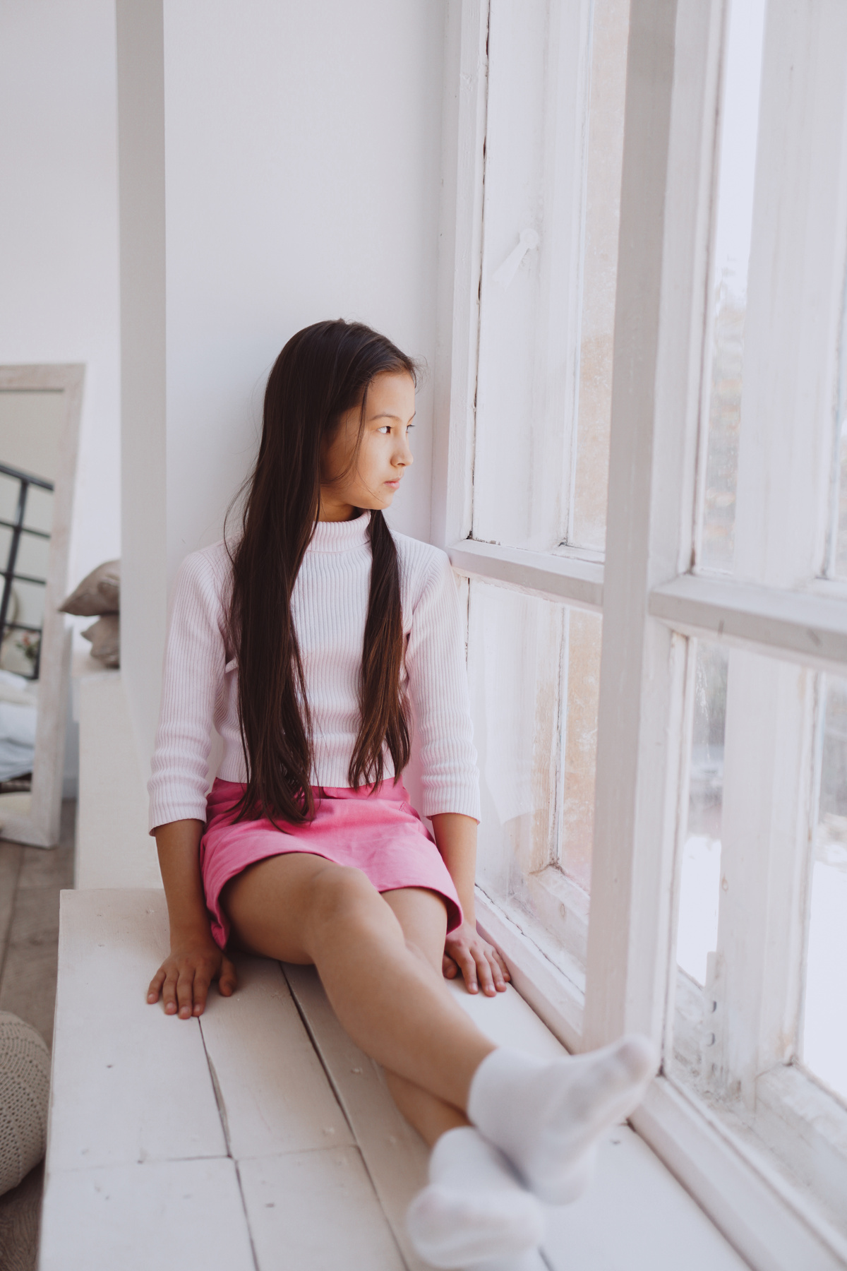 Girl Sitting on the Windowsill